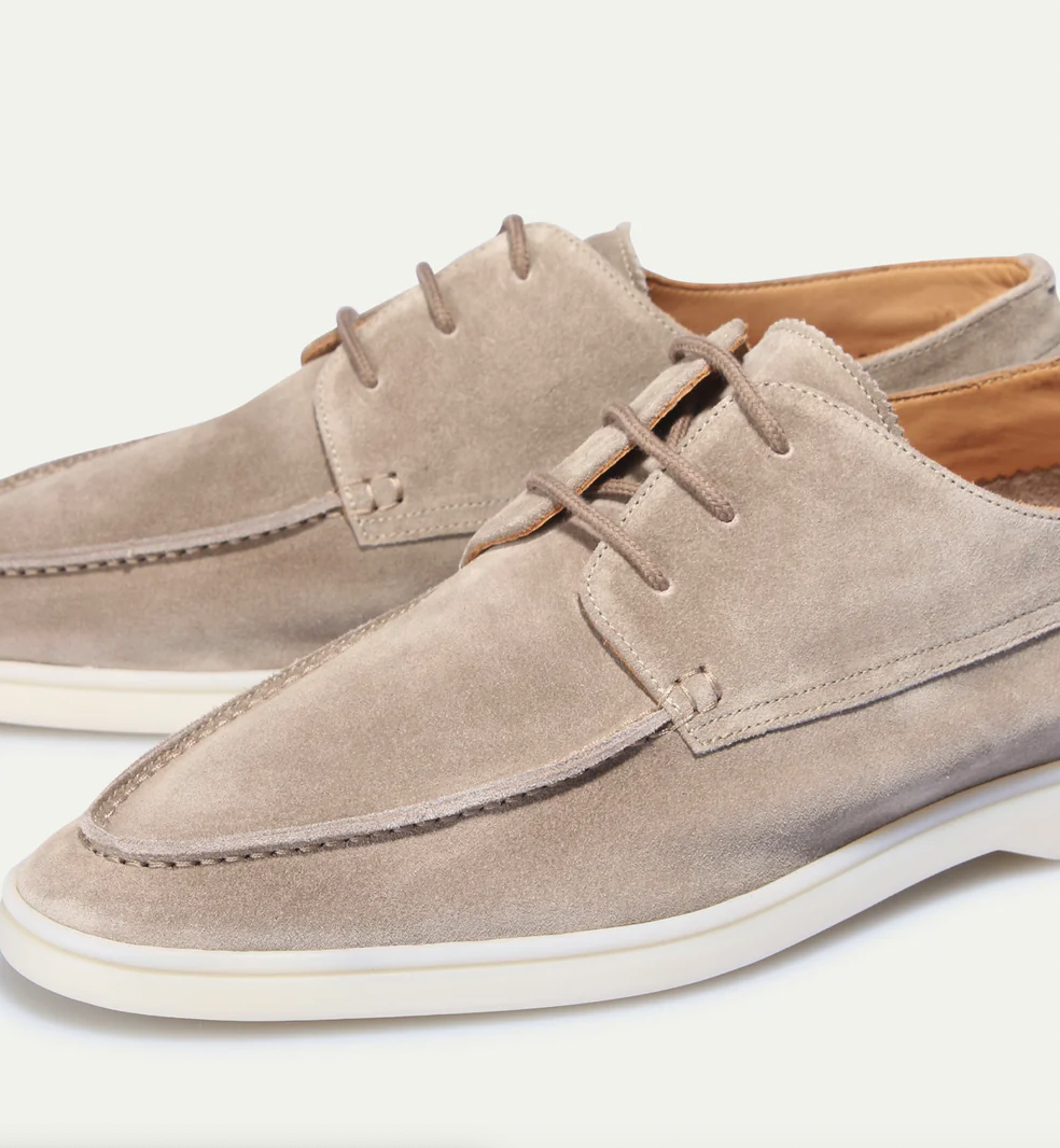 Men's lace-up boat shoes with moc toe stitching and flat sole