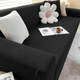 Textured stretch sofa slipcover on living room seating
