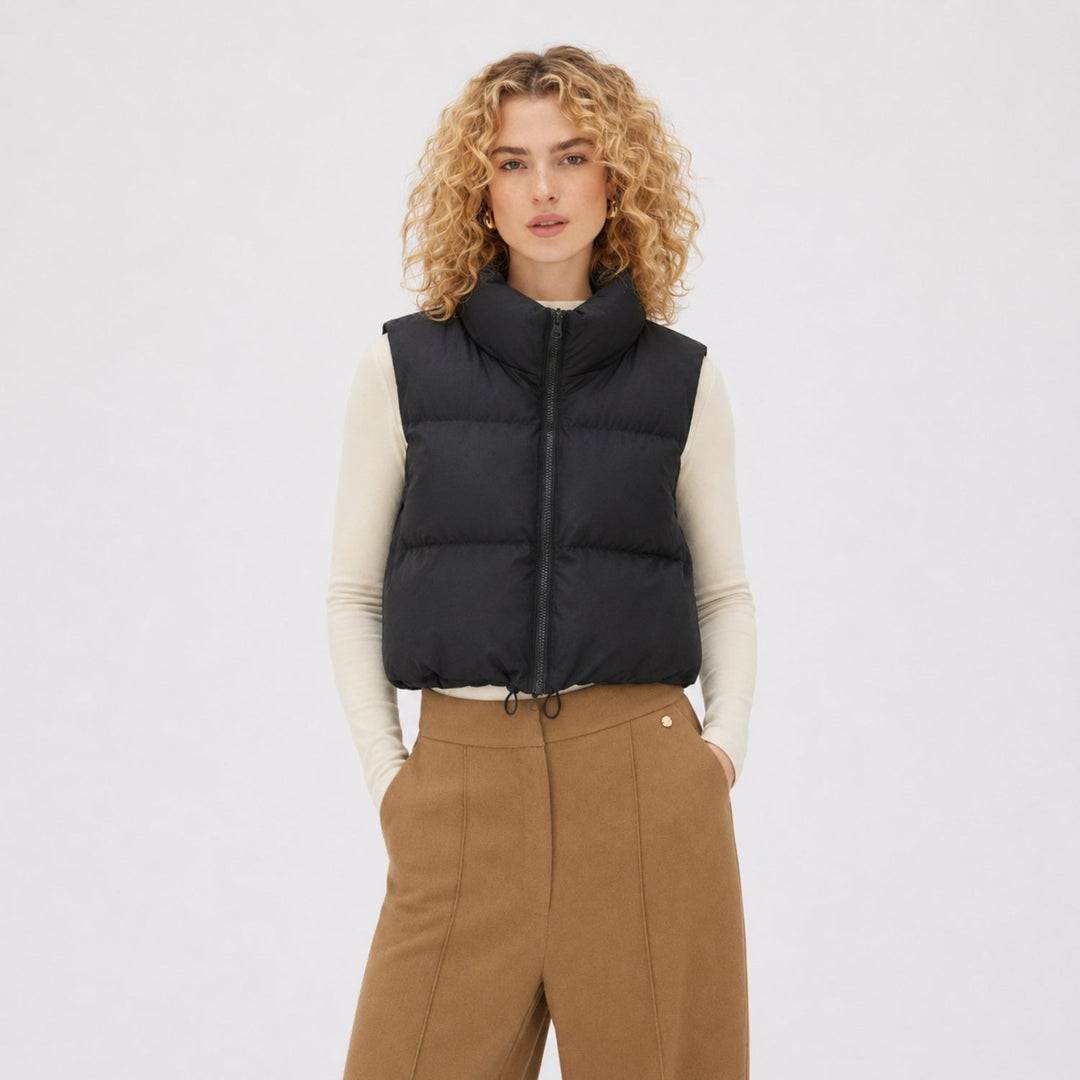 Women's cropped quilted puffer vest with high collar and front zipper