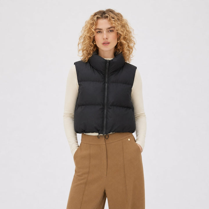 Women's cropped quilted puffer vest with high collar and front zipper