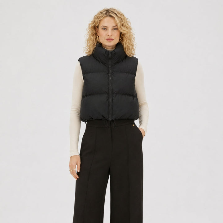 Women's cropped quilted puffer vest with high collar and front zipper