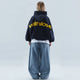 Women's hooded pullover with long sleeves and large back text graphic