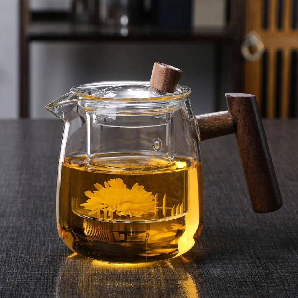 Clear glass teapot with central infuser and wood-effect handle