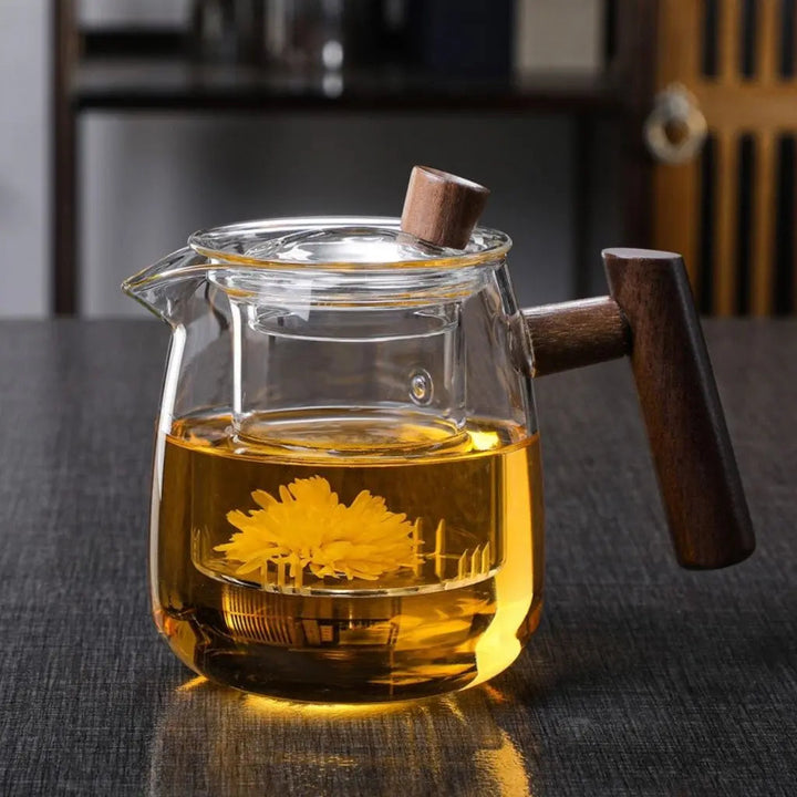 Clear glass teapot with central infuser and wood-effect handle