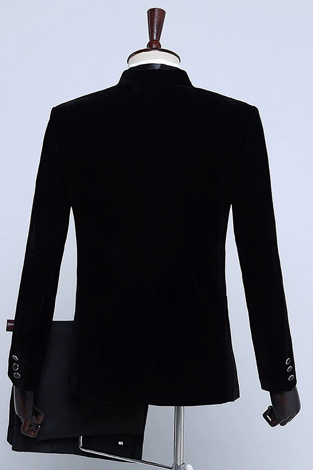 Men's velvet-textured tuxedo suit with peak lapels, bow tie and matching trousers