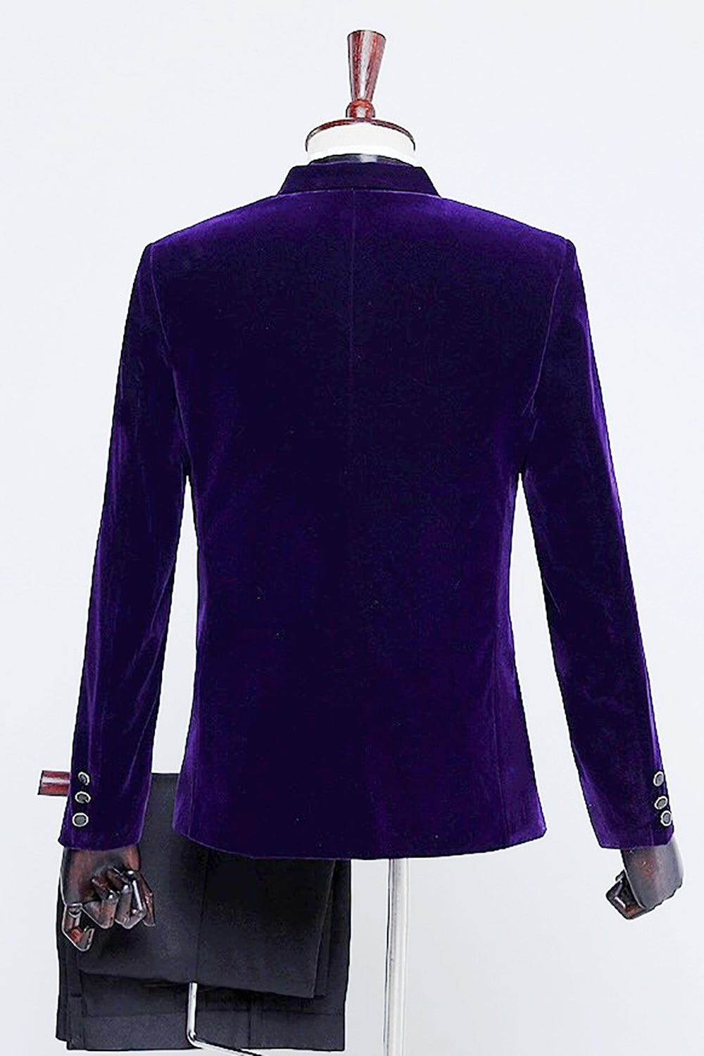 Men's velvet-textured tuxedo suit with peak lapels, bow tie and matching trousers
