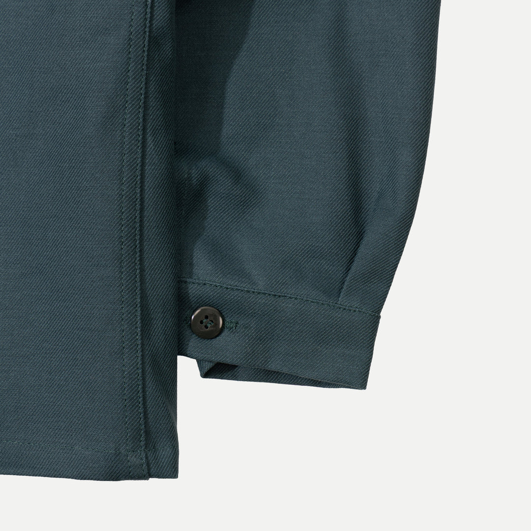 Men's dark green utility jacket with spread collar, button front and patch pockets