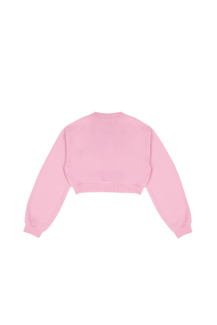 Women's pink cropped crewneck sweatshirt with long sleeves and white chest logo