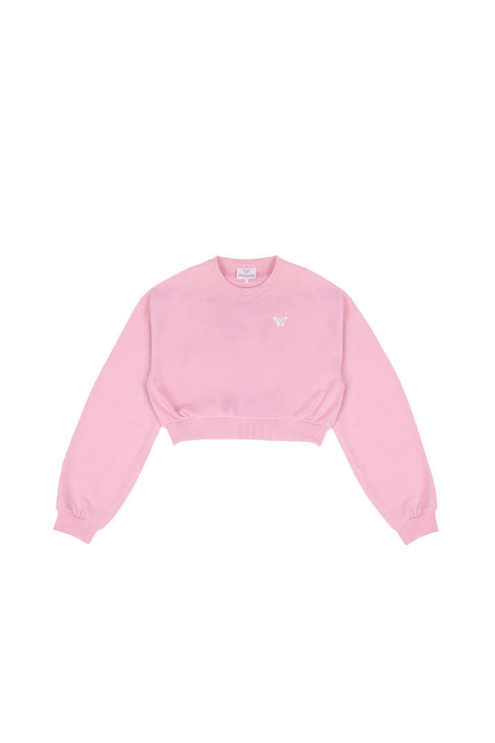 Women's pink cropped crewneck sweatshirt with long sleeves and white chest logo