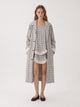Women's light checked trench coat with long sleeves and button front