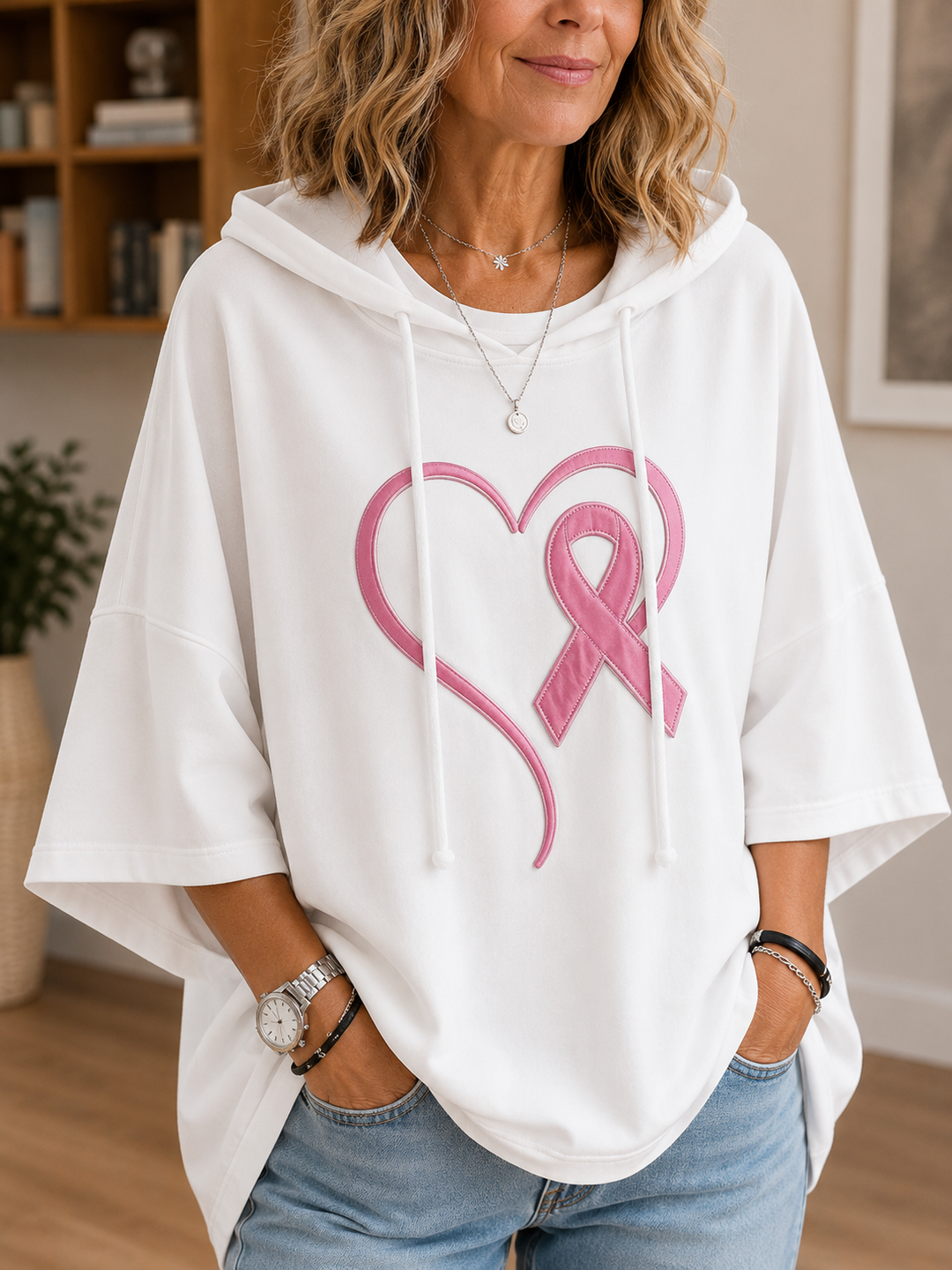 Women's pink hooded pullover with raised awareness ribbon motif