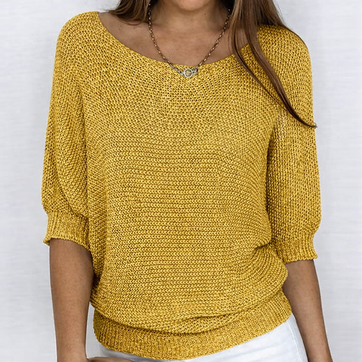 Women's textured knit sweater with round neckline and three-quarter sleeves