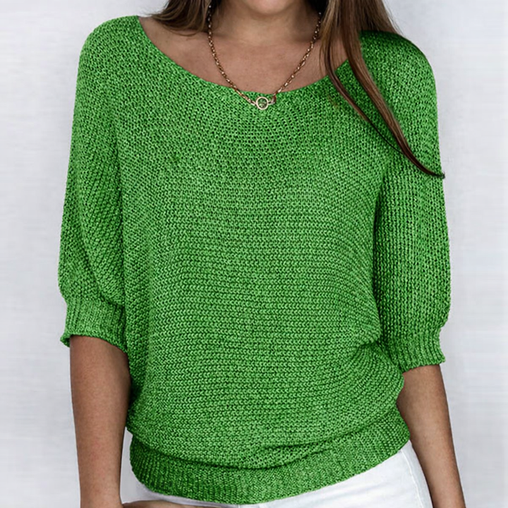 Women's textured knit sweater with round neckline and three-quarter sleeves