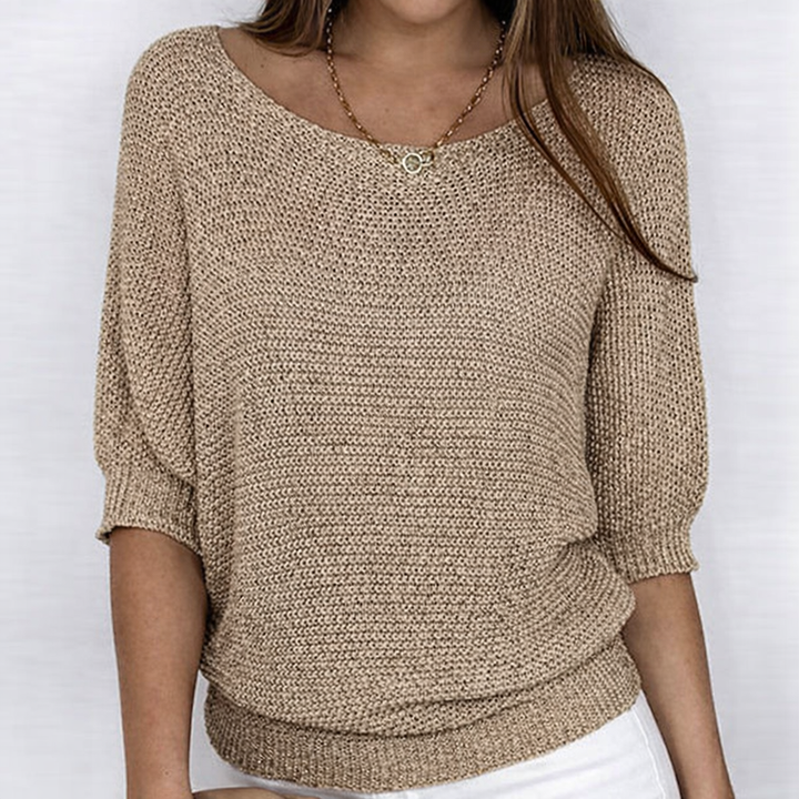 Women's textured knit sweater with round neckline and three-quarter sleeves