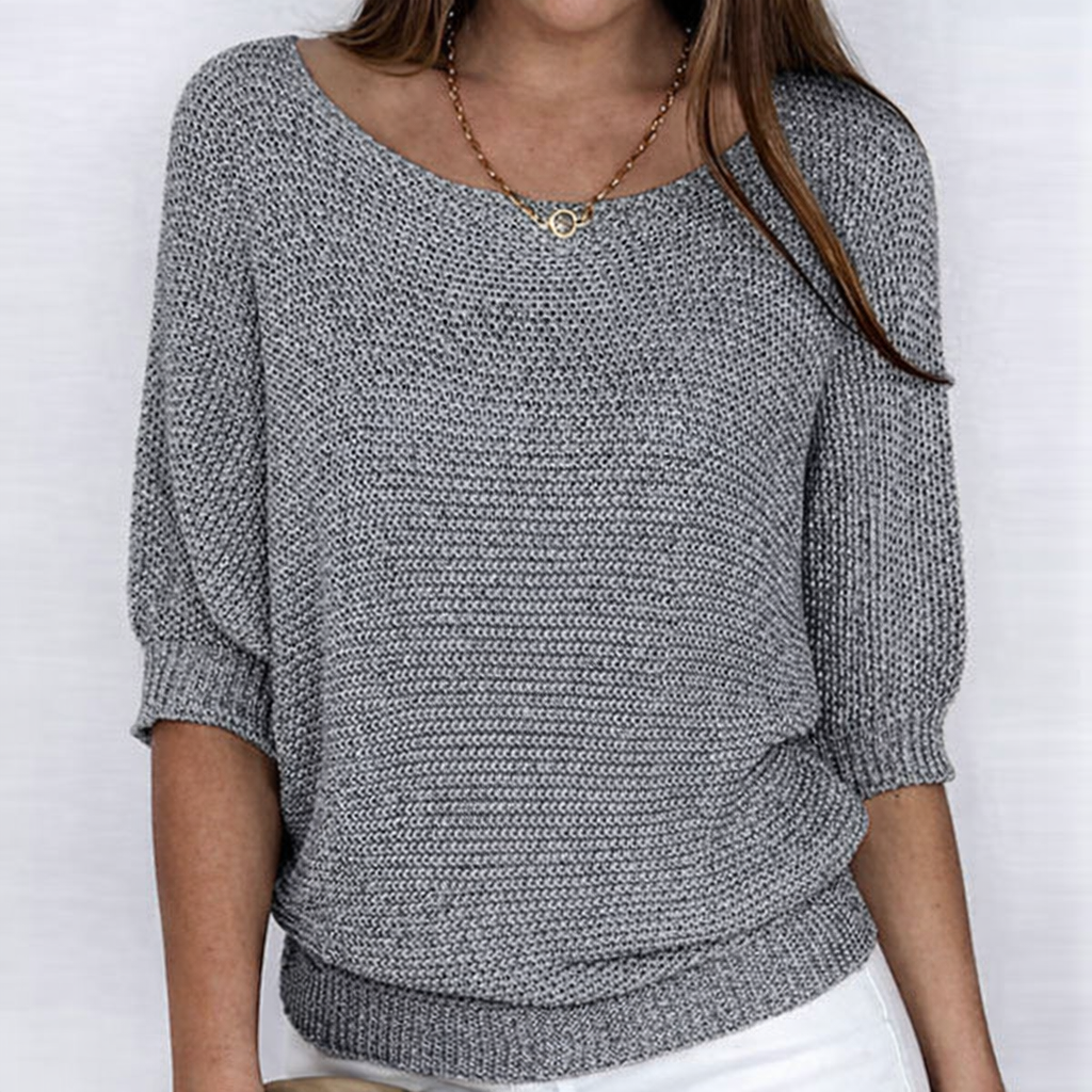 Women's textured knit sweater with round neckline and three-quarter sleeves