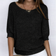 Women's textured knit sweater with round neckline and three-quarter sleeves