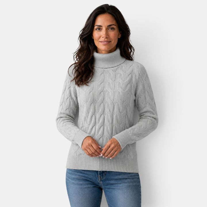 Women's long-sleeve cable knit turtleneck sweater with ribbed trims