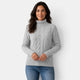 Women's long-sleeve cable knit turtleneck sweater with ribbed trims
