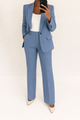 Women's two-piece trouser suit with a single-button blazer and wide-leg pants