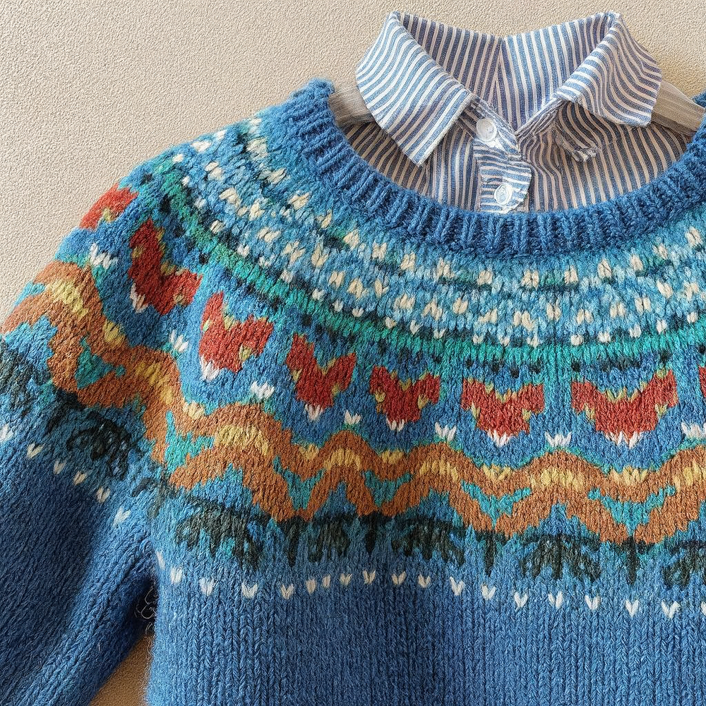 Women's blue geometric knit sweater with crew neck and long sleeves