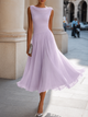 Women's sleeveless boat neck midi dress with pleated skirt in white and black