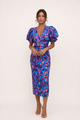 Women's patterned midi dress with puff sleeves and V-neckline in purple and yellow geometric print