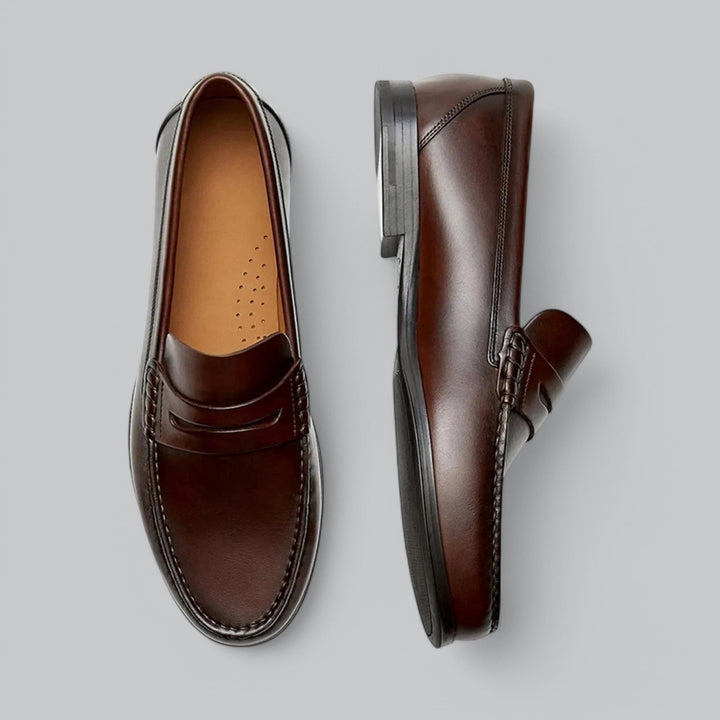 Leather loafers with penny strap detail shown in brown and black