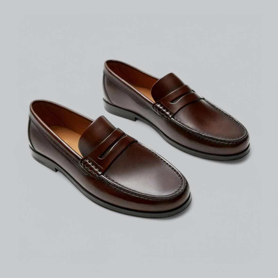 Leather loafers with penny strap detail shown in brown and black