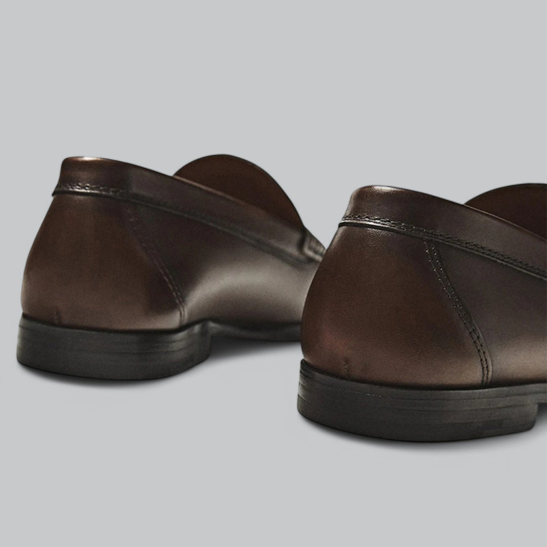 Leather loafers with penny strap detail shown in brown and black