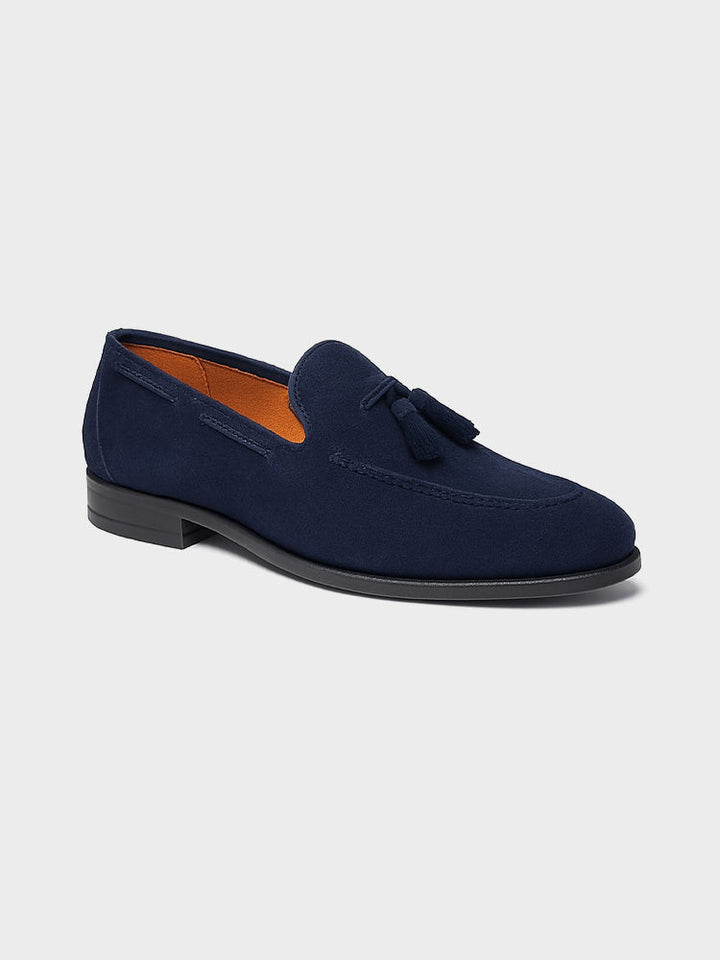 Men's navy tassel loafers with almond toes and low heels