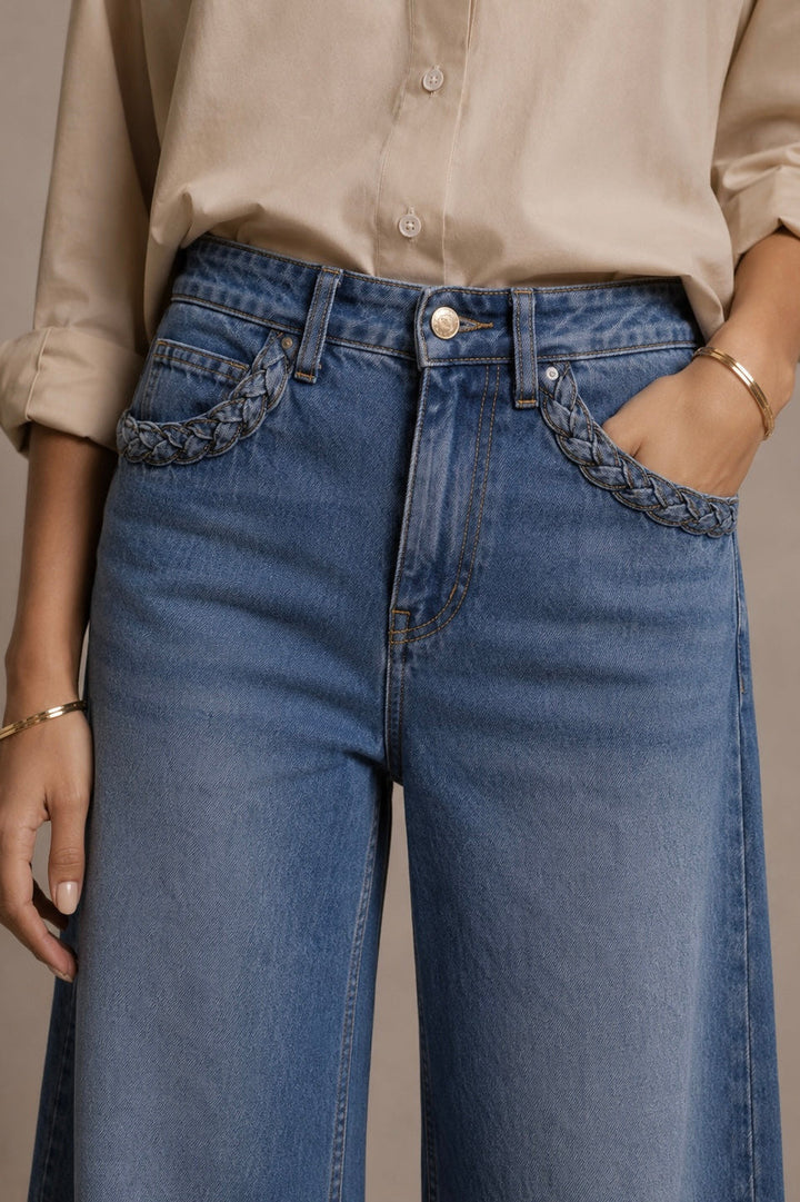 Women's blue wide leg jeans with high-rise waist and braided pocket trim
