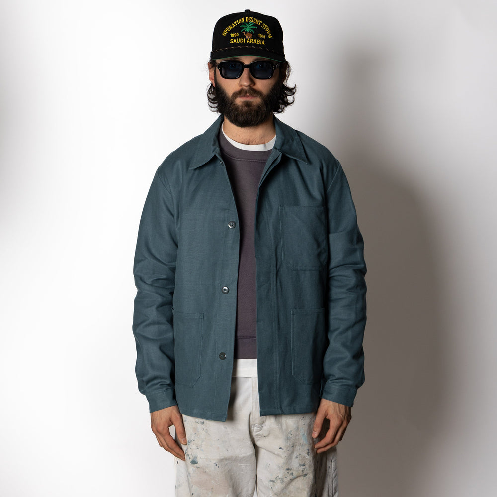 Men's dark green utility jacket with spread collar, button front and patch pockets