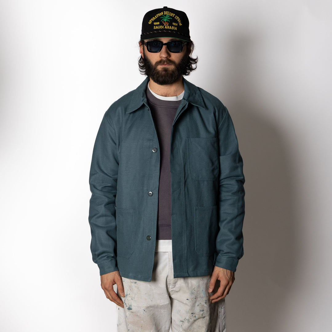 Men's dark green utility jacket with spread collar, button front and patch pockets