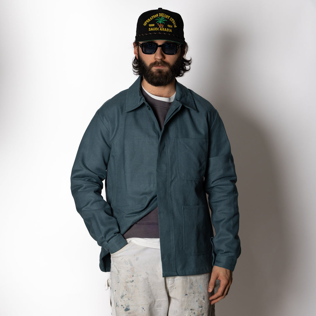 Men's dark green utility jacket with spread collar, button front and patch pockets