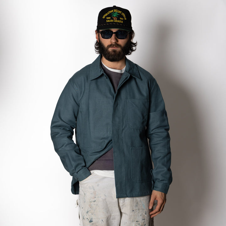 Men's dark green utility jacket with spread collar, button front and patch pockets
