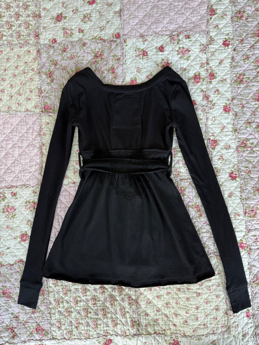 Women's long-sleeve wrap babydoll top with V-neck and tie waist