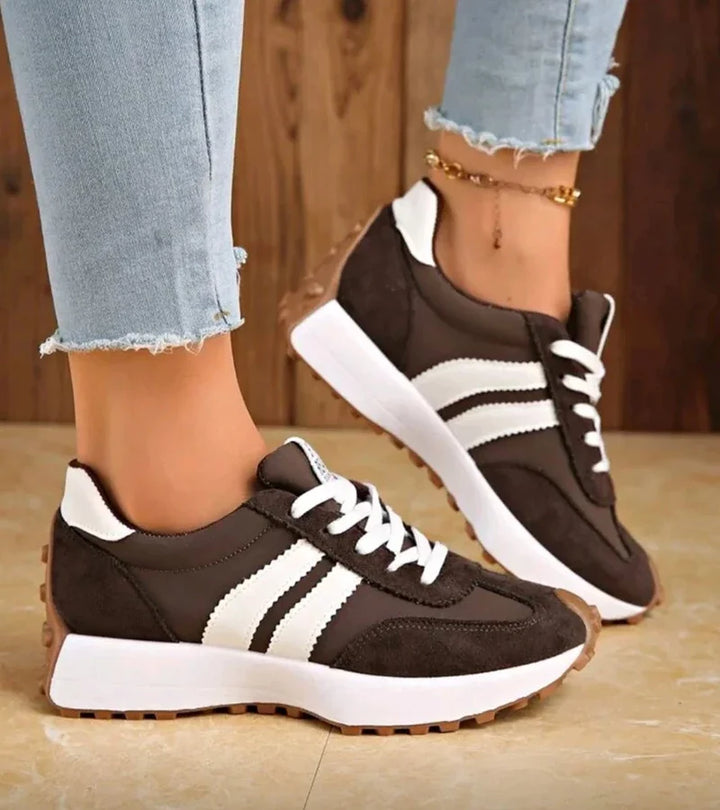 Women's low-top lace-up sneakers with contrast side stripes and raised sole