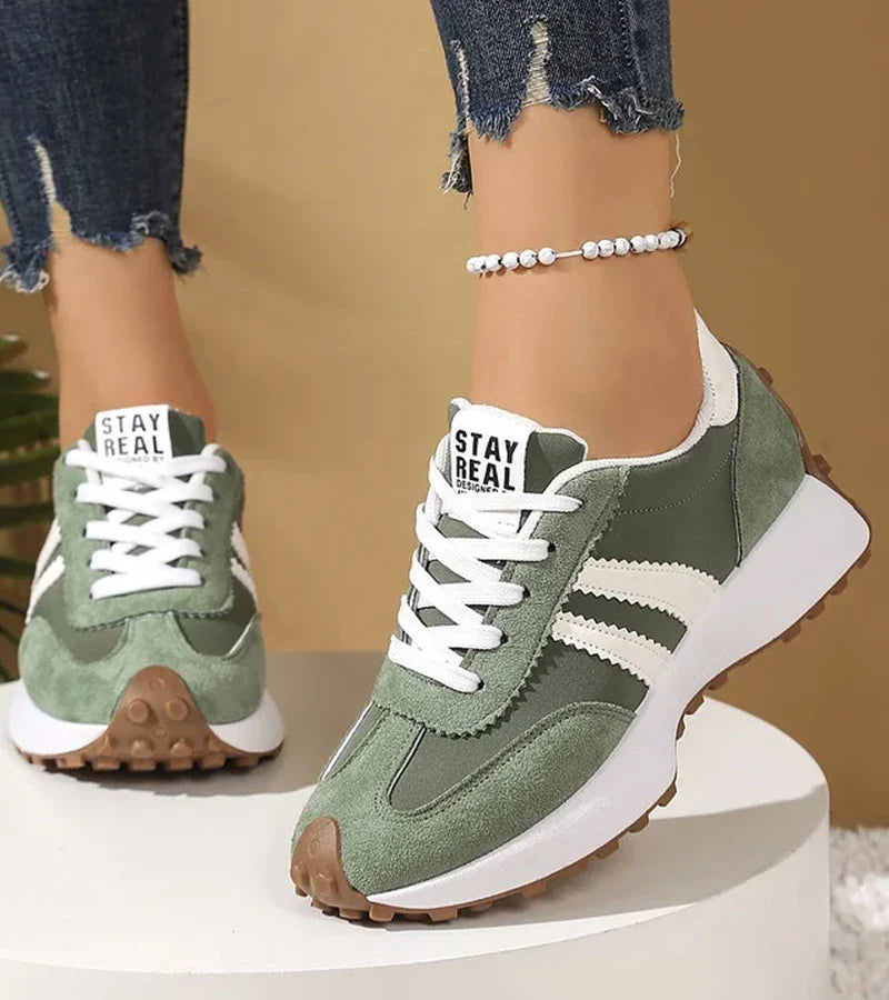 Women's low-top lace-up sneakers with contrast side stripes and raised sole