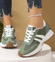 Women's low-top lace-up sneakers with contrast side stripes and raised sole