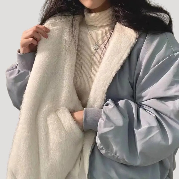 Women's padded high-collar winter jacket with zip front and flap pockets