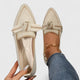 Women's pointed-toe slip-on loafers with knot detail and contrast trim