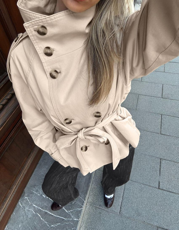 Women's belted double-breasted trench coat with high collar and long sleeves