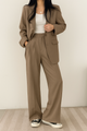 Women's beige single-breasted suit with notch lapel blazer and high-waisted trousers