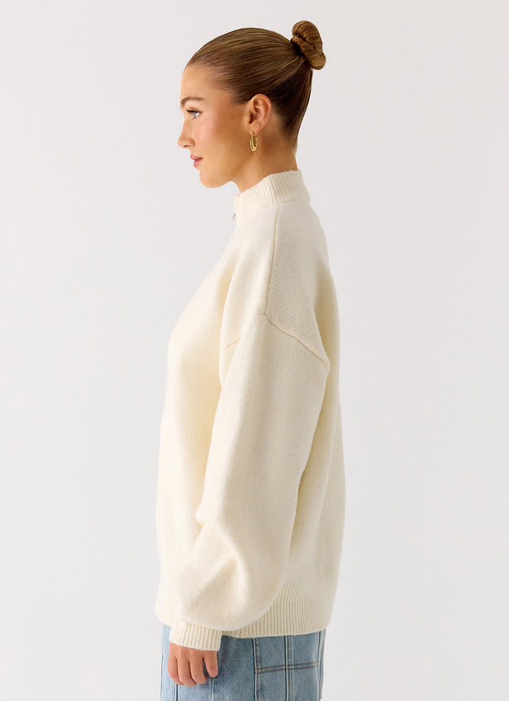 Women's ivory knit zip jacket with mock neck and long sleeves