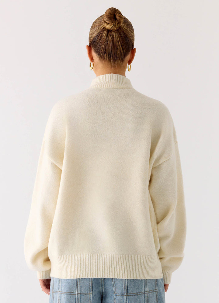 Women's ivory knit zip jacket with mock neck and long sleeves
