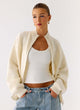 Women's ivory knit zip jacket with mock neck and long sleeves