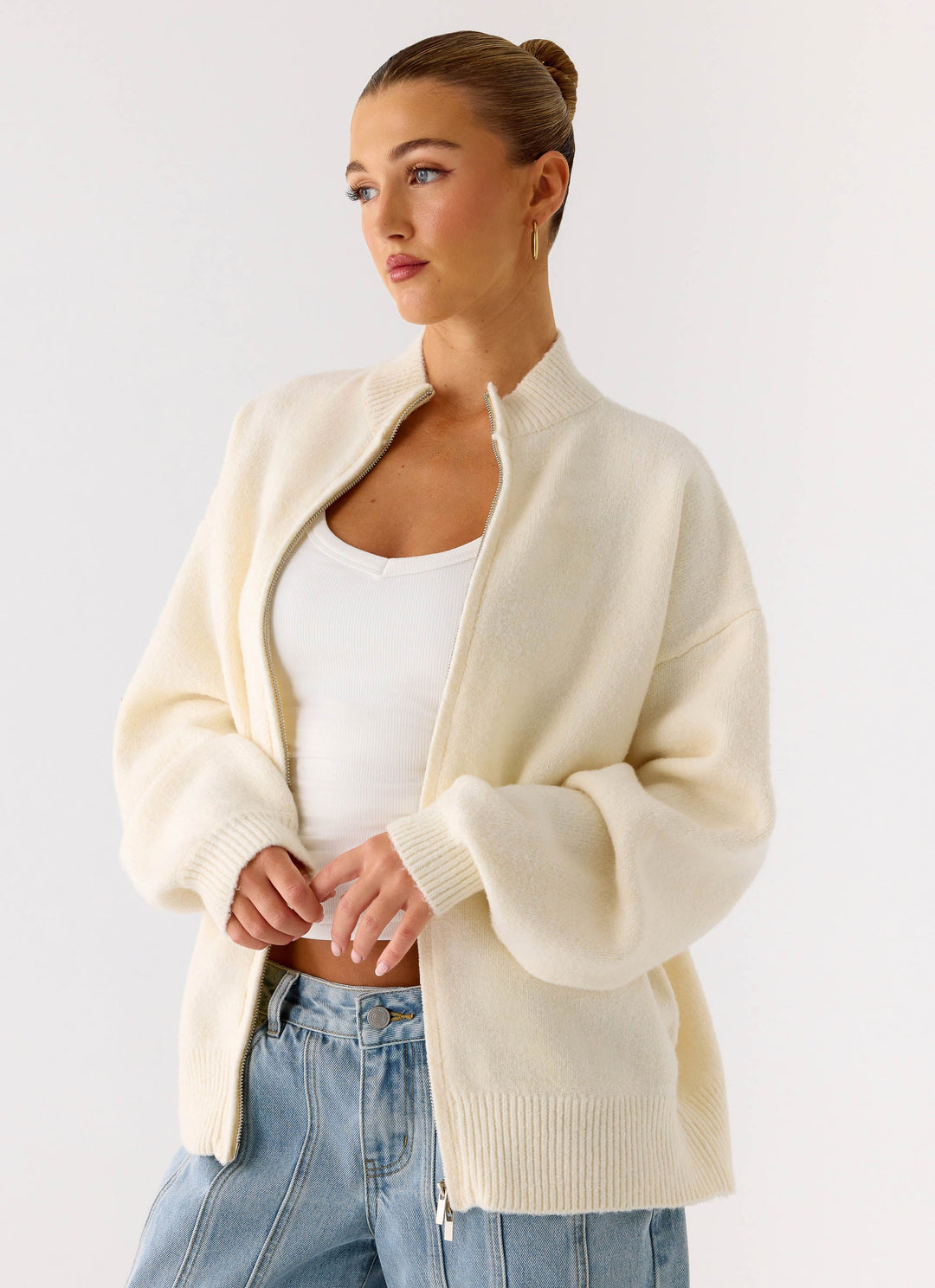 Women's ivory knit zip jacket with mock neck and long sleeves