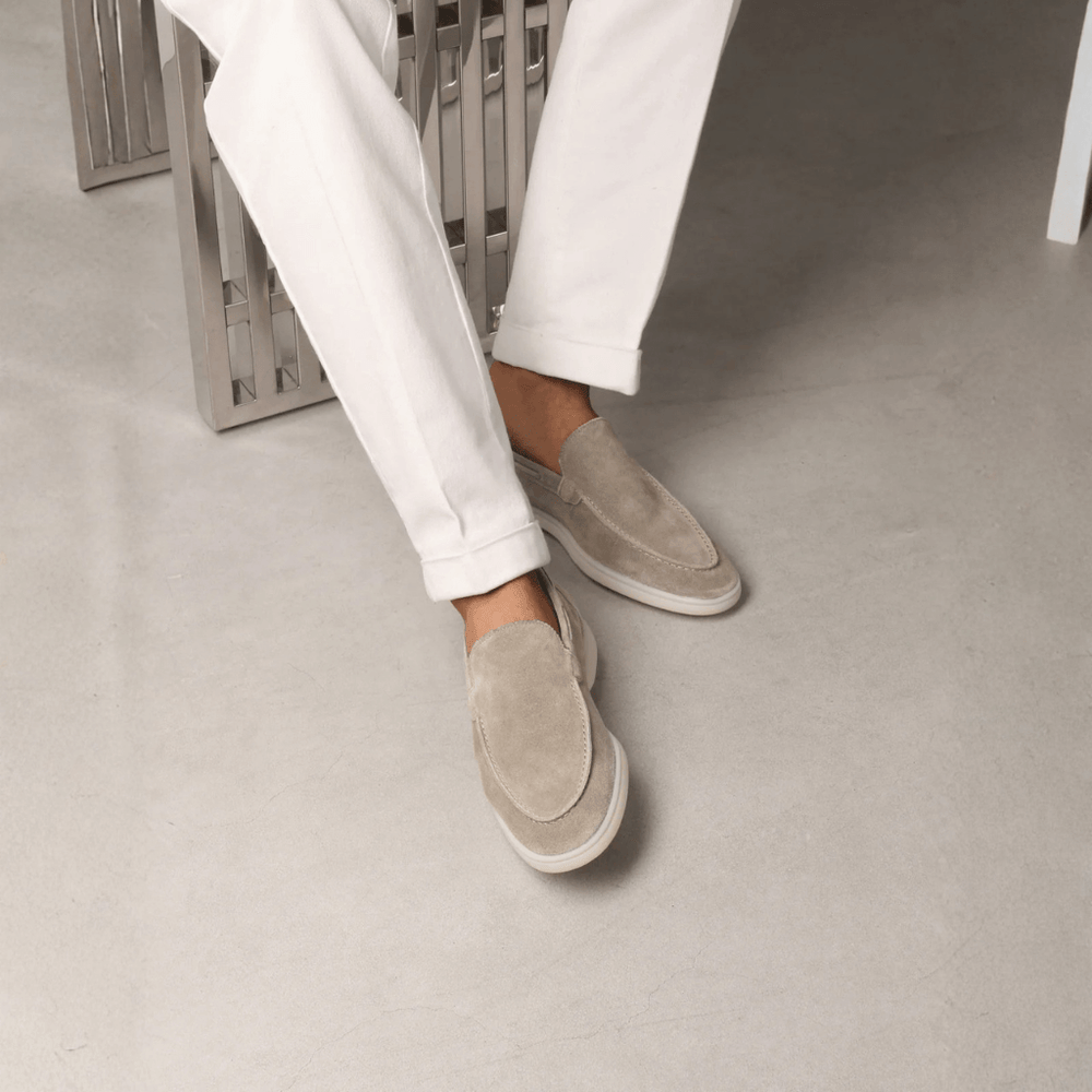 Men's taupe slip-on loafers with stitched apron detail and flat off-white soles