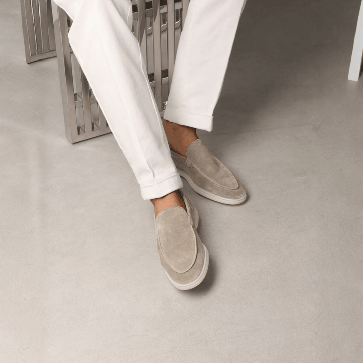 Men's taupe slip-on loafers with stitched apron detail and flat off-white soles