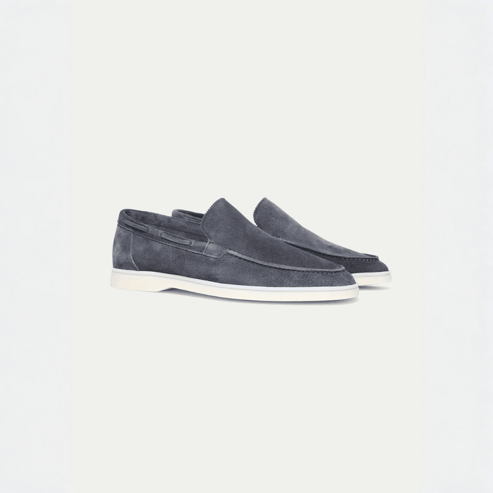 Men's grey slip-on loafers with moc toe and flat light-coloured soles